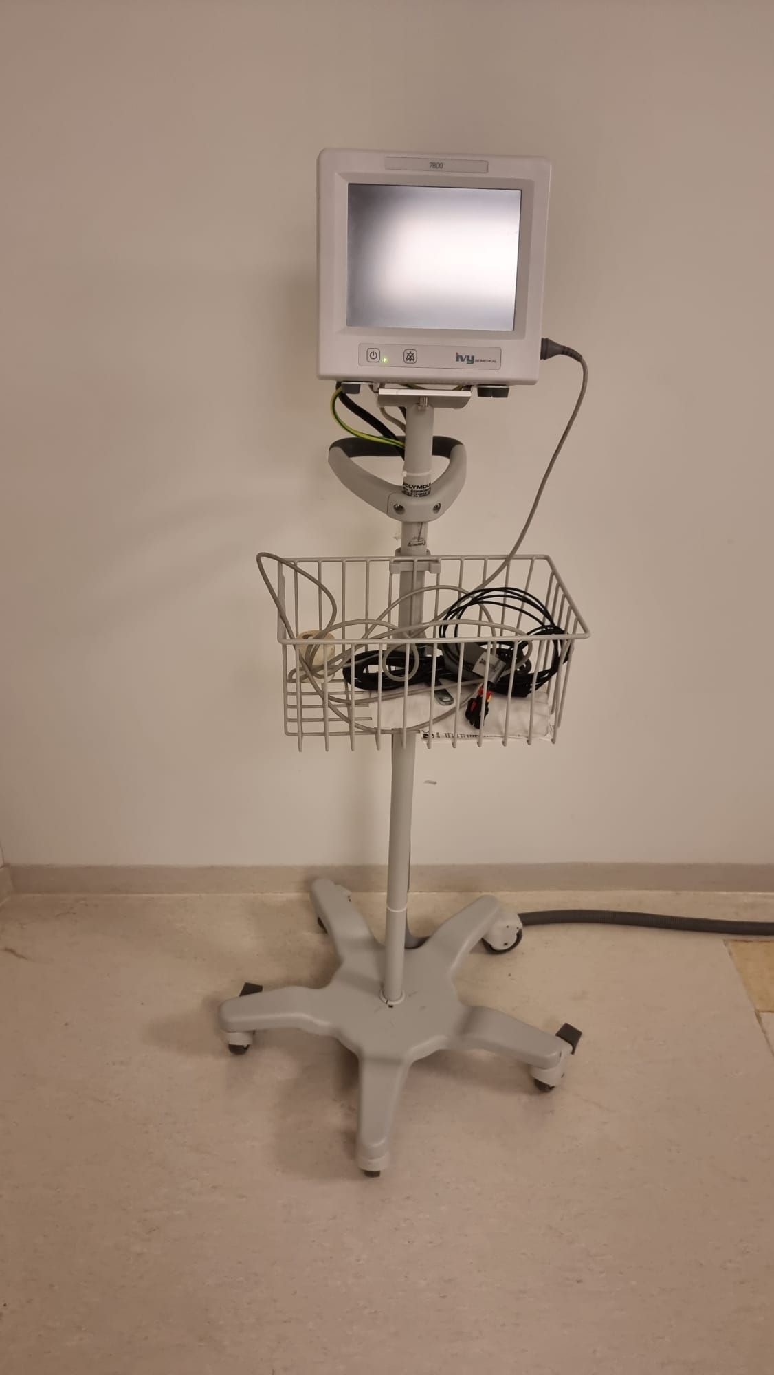 Ivy Biomedical Model 7800 ECG cardiac gating monitor on rolling stand with lead set included with this GE Optima CT660 128-slice CT for cardiac CT acquisitions — MTC Miami, Florida, USA