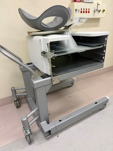 Side view of the Siemens Symbia Evo Excel collimator exchange cart with patient head holder stored on top