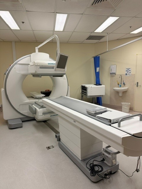 Siemens Symbia Evo Excel SPECT system with patient table and detectors in the nuclear medicine scan room