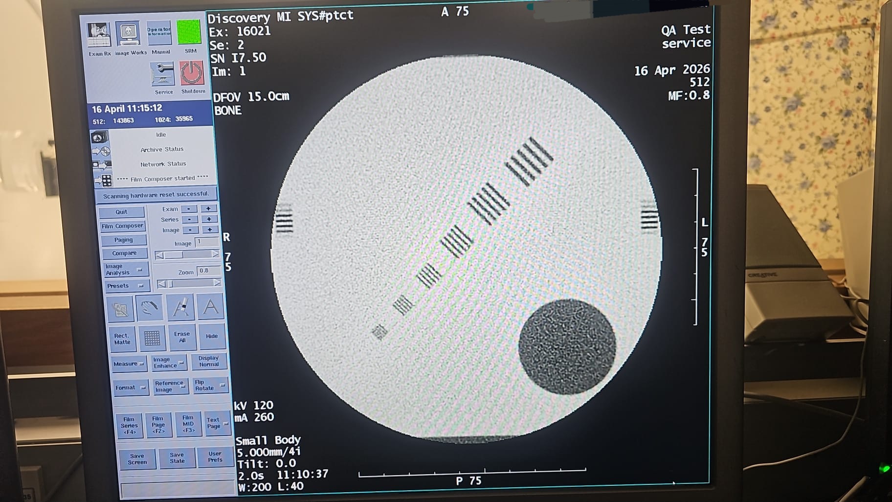 GE Discovery MI CT QA phantom resolution scan on operator console — bar pattern visibility confirms resolution test PASS