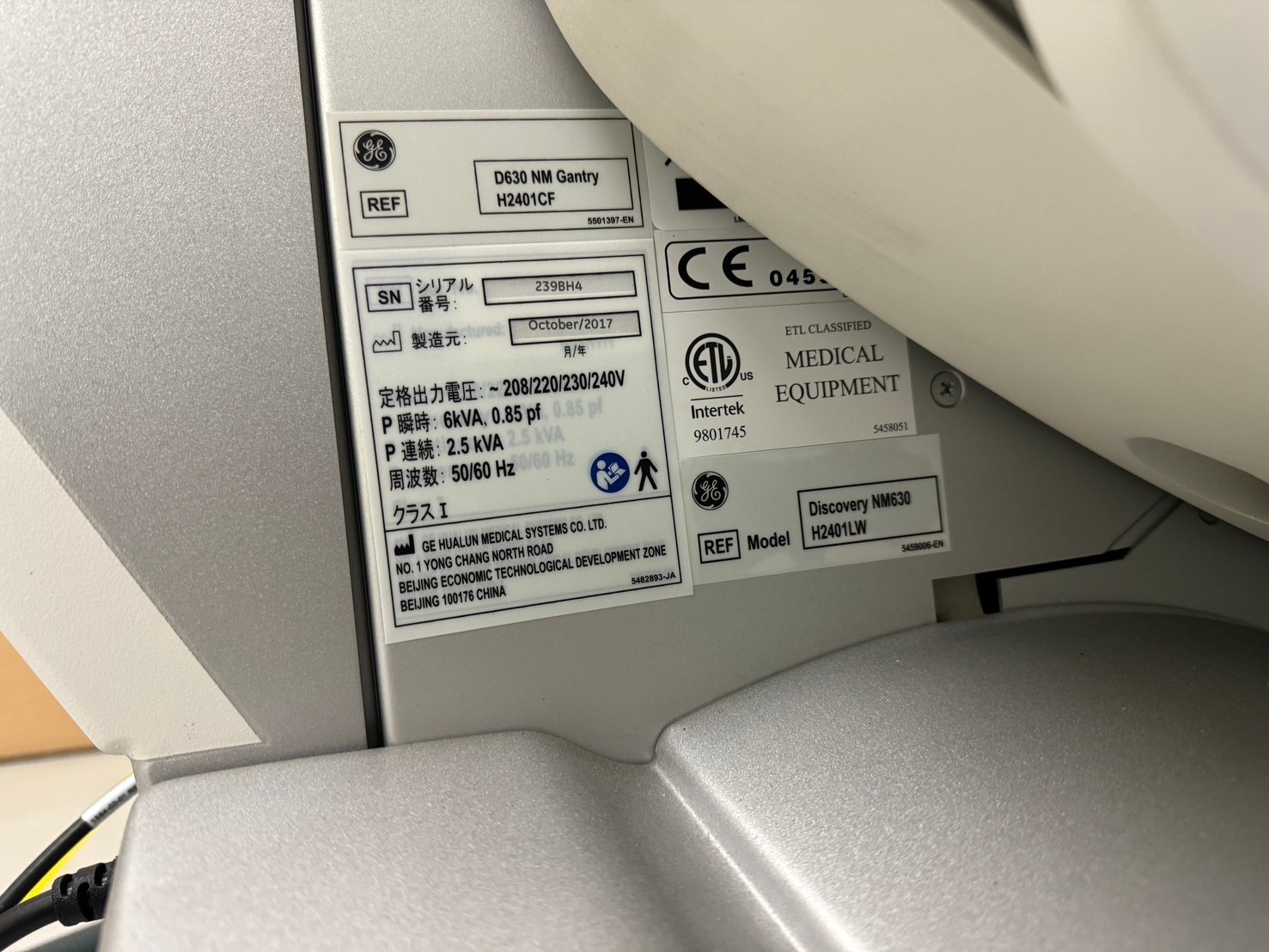 GE Discovery NM630 gantry identification label, model H2401LW, manufactured October 2017