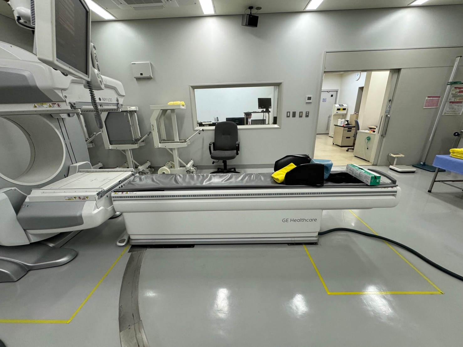GE NM/CT imaging system patient table and gantry side view in nuclear medicine suite