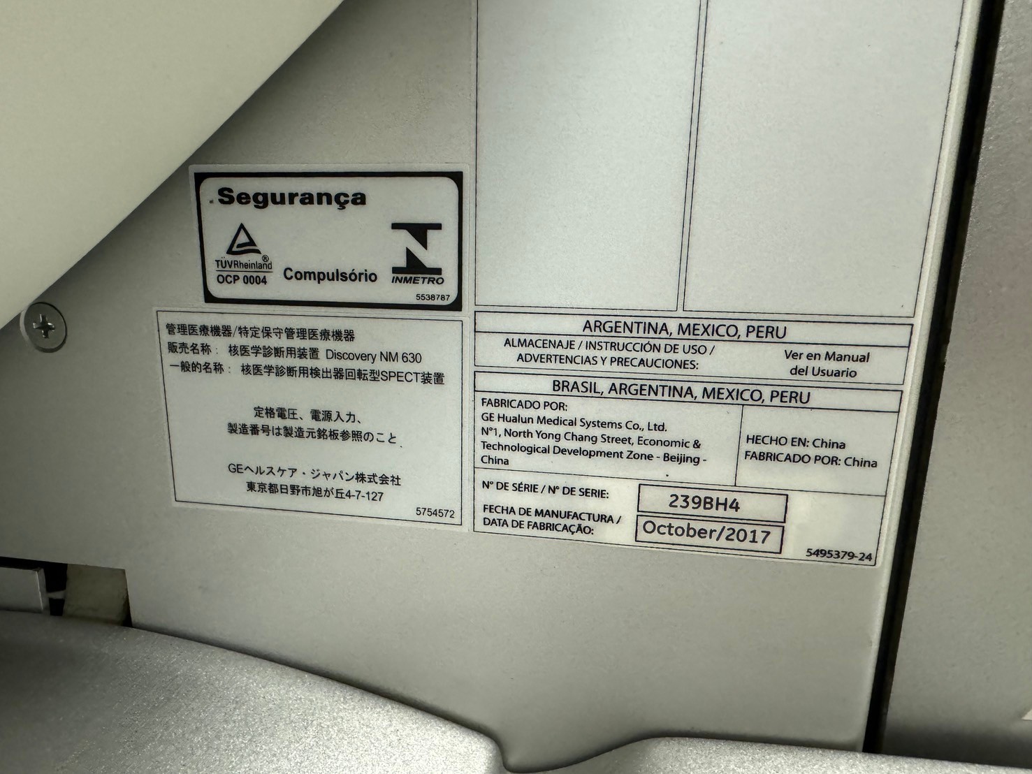 GE Discovery NM 630 safety and compliance label with serial number 239BH4, manufactured October 2017